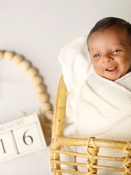 A heart-melting smile from this little one! Capturing these fleeting expressions is one of the biggest joys of being a newborn photographer.