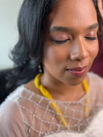 A close-up of Aruna's soft, shimmery pink eye makeup. It's a simple yet elegant choice for a minimalist bride.