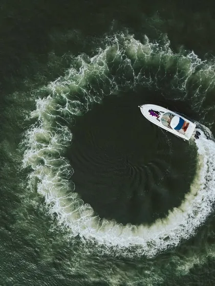 This aerial drone shot captures a luxury yacht carving a perfect circle in the water. It’s a unique and cinematic perspective that I bring to destination pre-wedding shoots, adding a touch of adventure and grandeur.