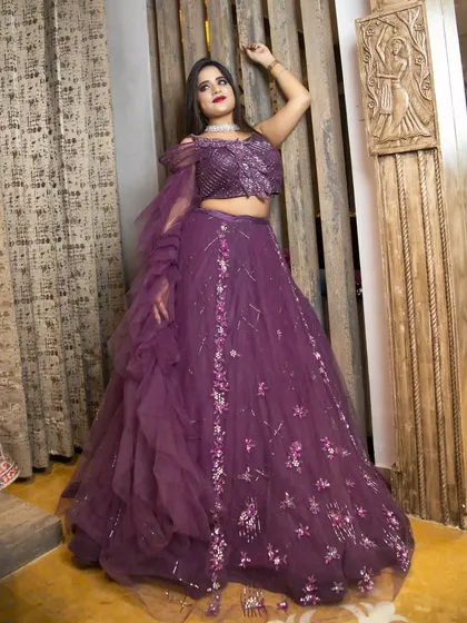 A dynamic pose that shows the volume and flow of the Odhni lehenga. For fashion brands, it's important to show not just what the garment looks like, but how it moves and feels.
