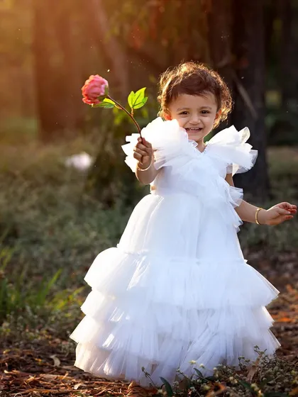 Oh, that magical golden hour light! This outdoor toddler portrait feels like a fairytale. Dressed like a little princess in a beautiful white gown, she just lit up the whole forest. These are the dreamy, candid moments I love capturing.