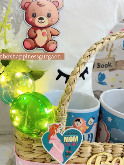 A detailed view of the glowing decorative balls and "MOM" tag inside the moon-themed hamper, adding a warm and personal touch.