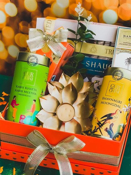 A closer look at the "Raunaq" hamper, showcasing the rich colors and premium products from brands like Gur Chini and Kama Ayurveda, making it a truly luxurious Diwali offering.