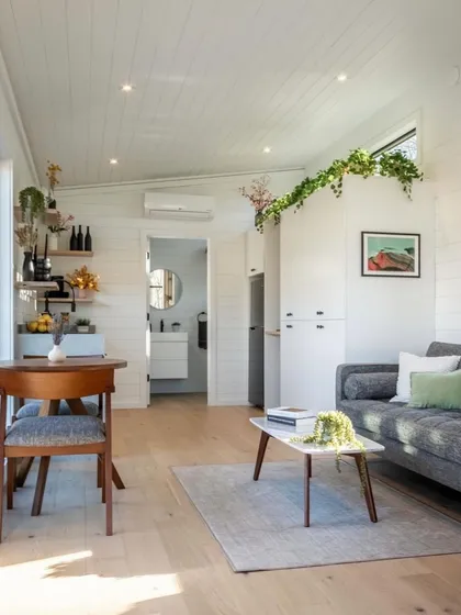 This interior shot shows the efficient use of space in one of our compact homes. The open-plan layout combines living, dining, and kitchen areas, creating a bright and airy feel.
