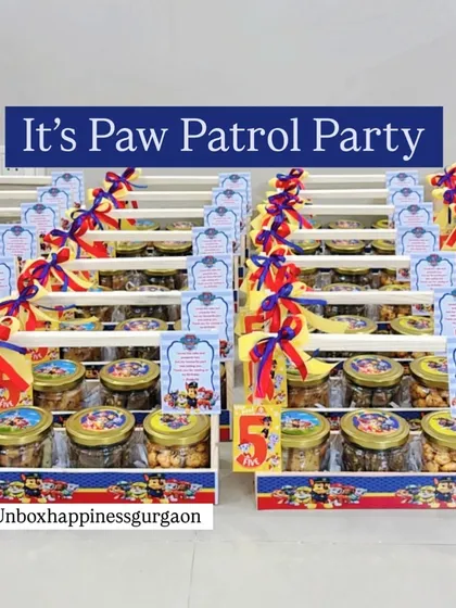 "It's a Paw Patrol Party!" This image shows a large order of 'Paw Patrol' themed return gifts, all lined up and ready for the celebration.