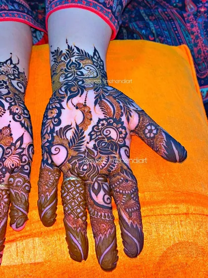 A single hand from a party design, showcasing the delicate and flowing patterns.