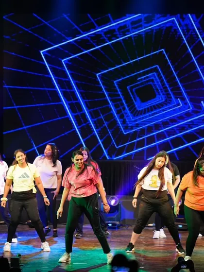 The whole crew in sync during a power-packed Zumba stage performance.