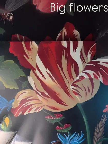 A close-up detail of a vibrant red and white striped tulip from the 'Big Flowers' mural. The rich color and precise brushwork showcase the level of detail I bring to even the largest installations.