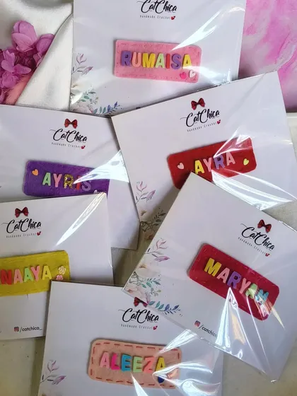 A batch of our felt name clips, all packaged and ready to go. These are a great budget-friendly option for personalized party favors.