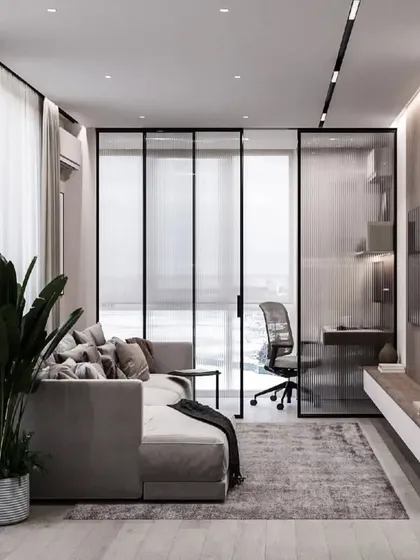 This project showcases smart space planning for a modern lifestyle. I created a dedicated home office nook separated by a sleek, black-framed glass partition. This solution maintains an open, airy feel in the living room while providing a quiet, functional workspace, perfect for work-from-home professionals.