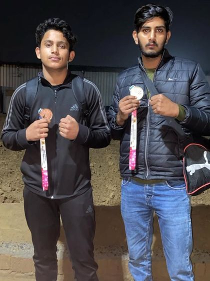 Two of our Wushu athletes proudly displaying their medals after the state championship.