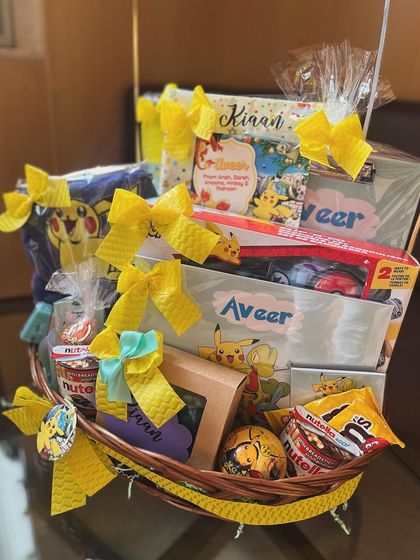 A Pokémon-themed birthday hamper filled with love and thoughtfulness. I used a bright yellow color scheme and included personalized items like name soaps and themed goodies.