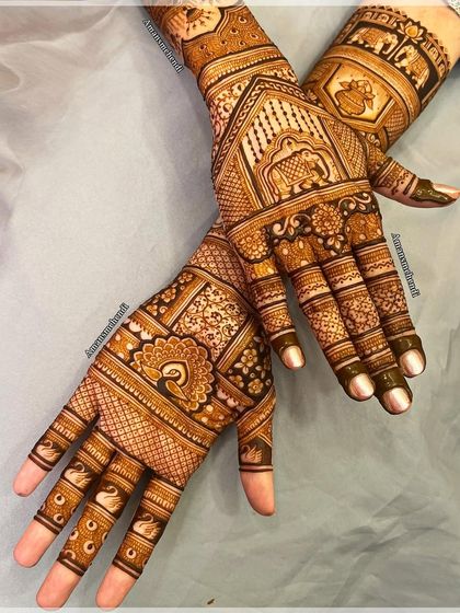 A beautiful and varied bridal set. The designs include peacocks, swans, elephants, and other traditional motifs, creating a rich tapestry of art on the hands.