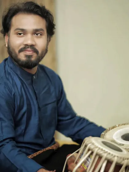 A series of photos from a baithak-style concert in Delhi with sarod player Pratik Shrivastav bhai. The intimate setting allows for a deeper connection with the audience.