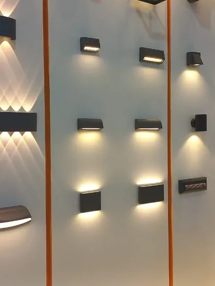 A wall of modern, minimalist up-and-down wall sconces, demonstrating clean lines and sophisticated lighting effects for contemporary spaces.