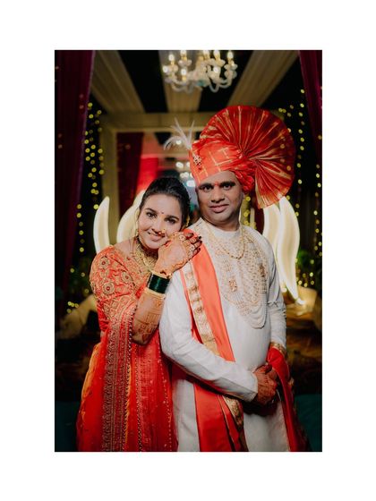 A classic portrait pose with the bride resting her head on the groom's shoulder, both radiating happiness on their wedding day in Mumbai.