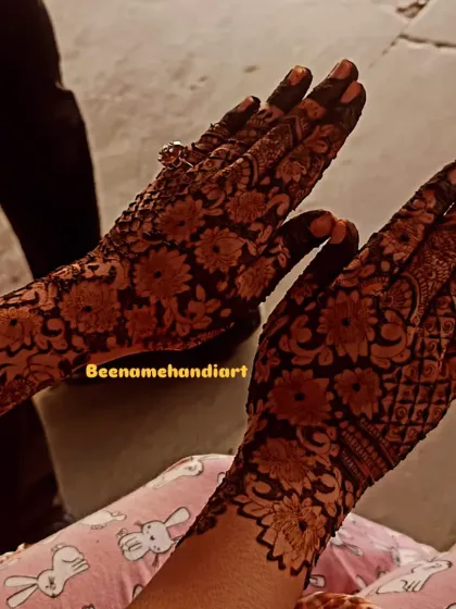 A full-hand design with a dense pattern of daisies, perfect for someone who loves floral mehandi.