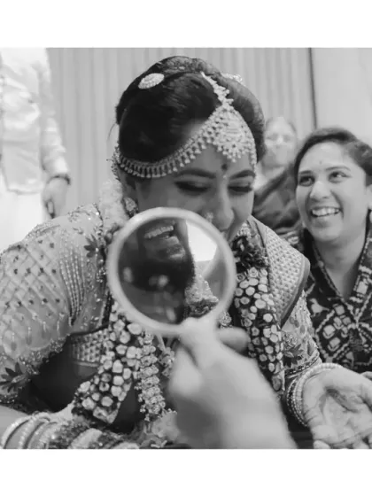 The fun and games after the wedding are where the real competition begins. This black and white shot of a post-wedding ritual in a Tamilian wedding focuses on the raw emotion, laughter, and playful tension.