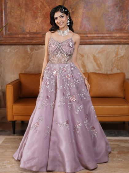 Eyes that whisper enchantment. This full-length shot shows off the beautiful lilac gown, perfect for a reception or engagement. The overall look is modern, romantic, and utterly captivating.