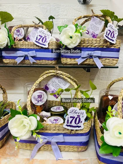 Celebrating a 70th birthday is a huge milestone, and this hamper was designed to feel just as special. I filled a handcrafted Kauna jute basket with a mix of treats and keepsakes, like a ceramic planter, dry cake, and scented candles, all in an elegant mauve and white theme.