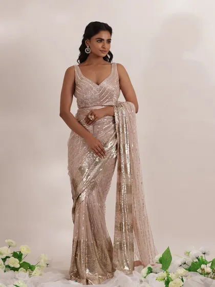 A full view of this stunning sequined saree, perfect for a cocktail party or reception. I love how the light catches the embellishments, making it a true showstopper outfit for any wedding event.