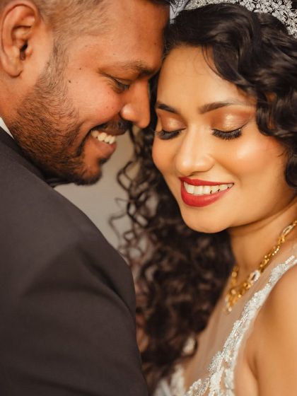 An extreme close-up capturing the pure joy and affection between the couple. These tight shots focus solely on the emotion of the moment.