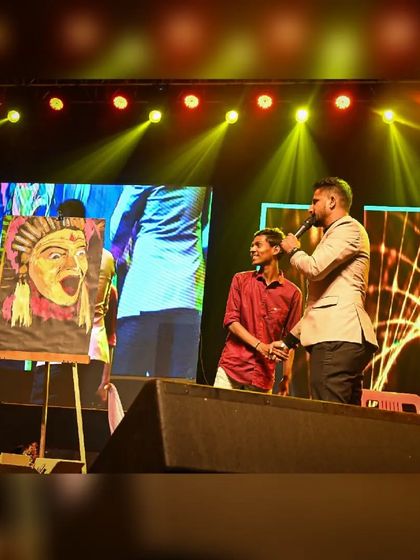 After a performance, I often get to share the story behind the art. Here I am on stage with the host, discussing the Kantara piece and the cultural inspiration behind it.