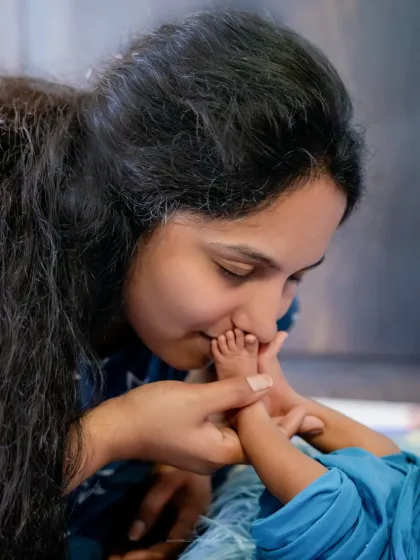 A mother's kiss on tiny toes. I focus on these small, tender interactions that speak volumes about the infinite love you have for your child.