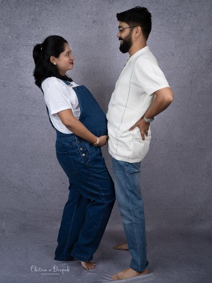 A hilarious "bump to bump" pose. This is a great example of how we can create fun and memorable photos that reflect your playful side.