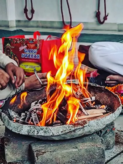 A sacred Havan (fire ceremony) being performed at our studio to mark our one-year anniversary and express gratitude to our community.