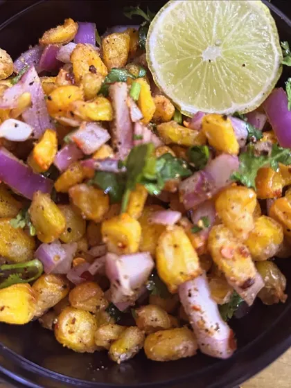 Crispy Corn salad, a tangy and spicy snack made with sweet corn, onions, and chaat masala.