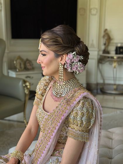 The side profile, showcasing the volume and soft texture of this popular bridal updo.