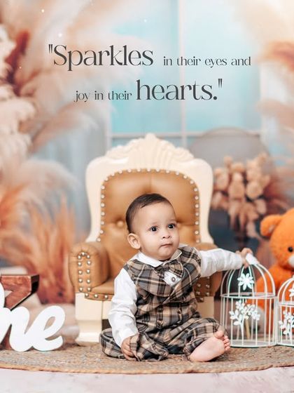 Dressed in a dapper plaid outfit, this little boy celebrates his first birthday in our cozy, boho-chic studio. We use props like birdcages and teddy bears to add a touch of whimsy.