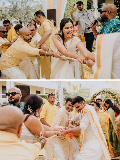 A fun game of tug-of-war between the bride's and groom's families, a playful battle that brings everyone together.