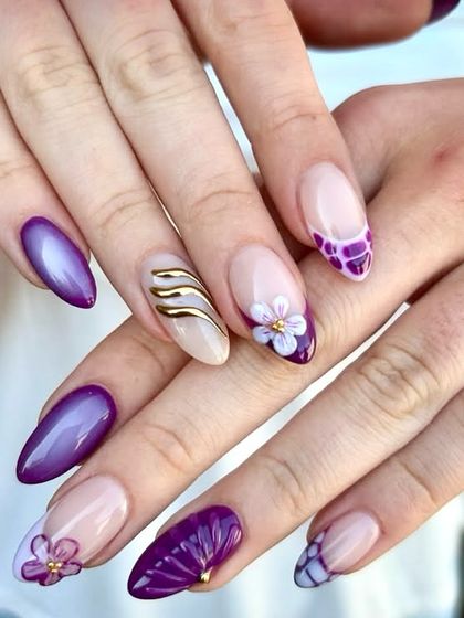 Purple dreams and floral beams. Every nail tells a story in this fairytale set, which includes purple cat-eye, a sculpted fan, 3D florals, and gold chrome accents.