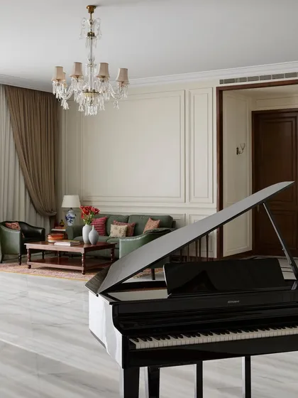 A film production office feels incomplete without music. Placing a baby grand piano in the heart of this lounge was an instinctive choice to make the space feel more like a home. It serves as a beautiful visual statement and a source of spontaneous creativity for jam sessions or quiet moments.