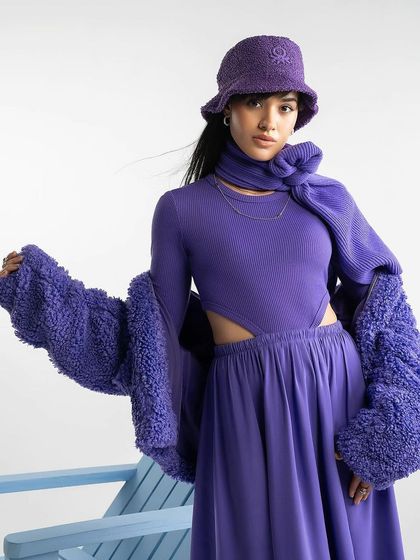 A monochromatic purple outfit from Benetton, showcasing creative layering for their winter collection.