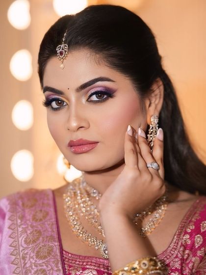 A close-up of the colorful pink and purple eye makeup. The blending is seamless, creating a beautiful gradient effect that is both artistic and wearable.