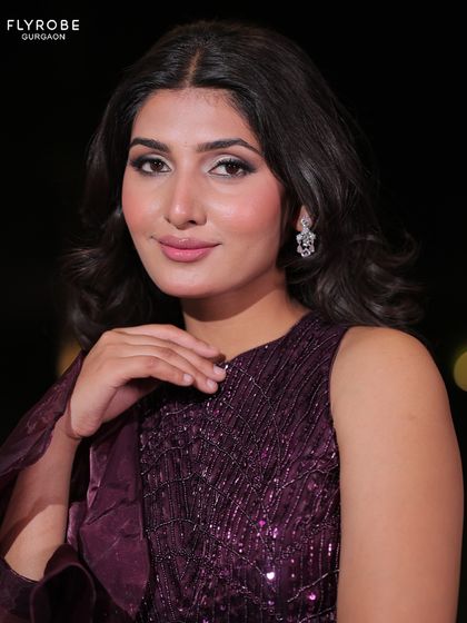 A beautiful close-up shot highlighting the sequined blouse and the model's flawless makeup. This is what glamour looks like.