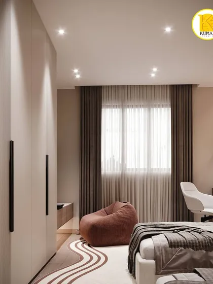 This view shows the full-height wardrobe with minimalist black handles and a cozy bean bag for reading.
