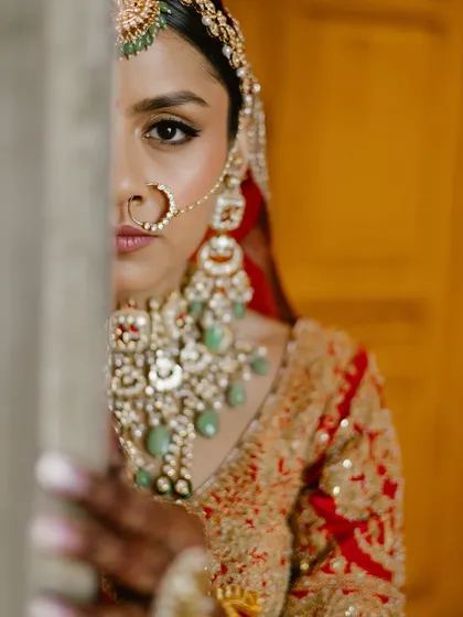 This artistic shot highlights the intensity of the kohl-rimmed eyes, a key feature of this traditional bridal look. It’s about creating a gaze that is both powerful and soulful.