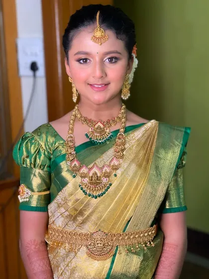 Styling for a half-saree ceremony is so special. I created an age-appropriate, radiant look for this young lady, complete with traditional jewelry and a beautiful hairstyle, making her feel like a princess on her big day.