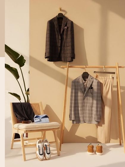 Step into a world of calm and comfort with our laid-back summer lineup. This flat lay of plaid blazers and neutral basics encourages you to embrace the moment.
