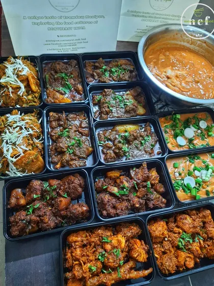 A catering order ready for delivery, featuring pork stir-fry, chicken stir-fry, duck curry, and 'bambooshoots eromba'.