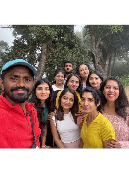 Our trip leader taking a selfie with a group of happy travelers.