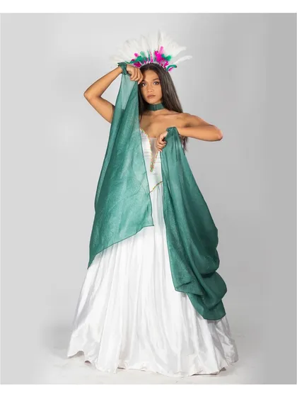 A more fluid and gentle pose, this image showcases the soft drape of the white gown and the contrasting green fabric. It conveys a sense of elegance and movement, suitable for editorial storytelling.