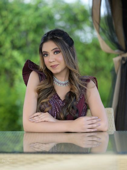 A beautiful outdoor shot. The makeup looks just as stunning in natural light, proving its versatility.