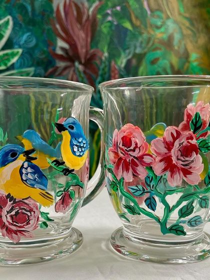 A set of our hand painted chai cups, one with lovebirds and the other with beautiful pink roses. They make a perfect pair for sharing tea with someone special.