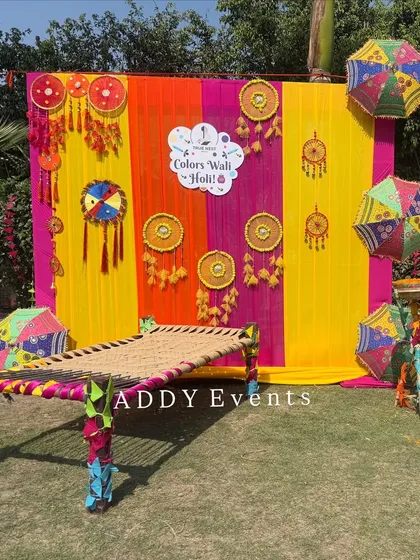 A traditional and colorful photo booth created for a Holi celebration. Featuring a charpai (woven cot), bright drapes, and festive hangings, this setup provides a perfect, on-theme spot for employees to take memorable photos.
