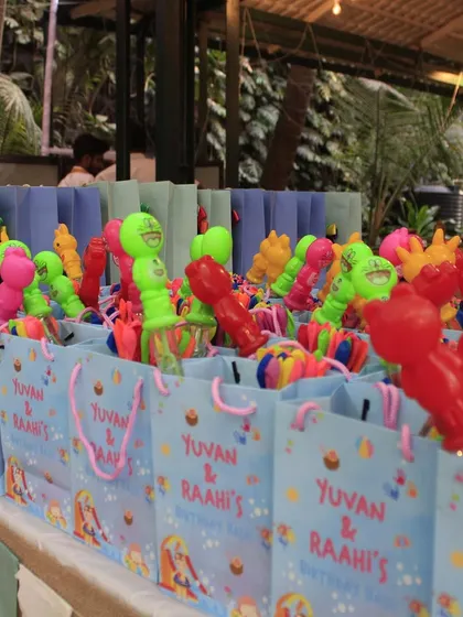 An Aqua Adventure themed Holi party. I created a gift shop with return favors, piñata goodies, and game prizes, including these colorful goodie bags.